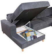 Graue Wohnlandschaft ANABELLE mit Stauraum, geöffnete Perspektive, zeigt Kissen im Fach.