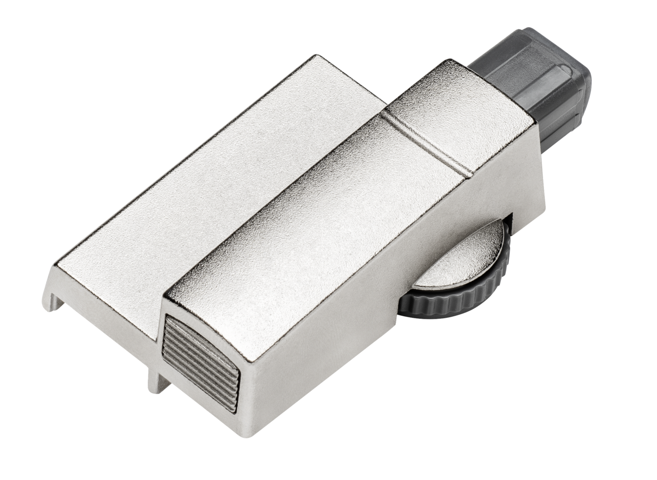 Metallischer Dämpfer in schräger Draufsicht mit geriffeltem Einstellrad.