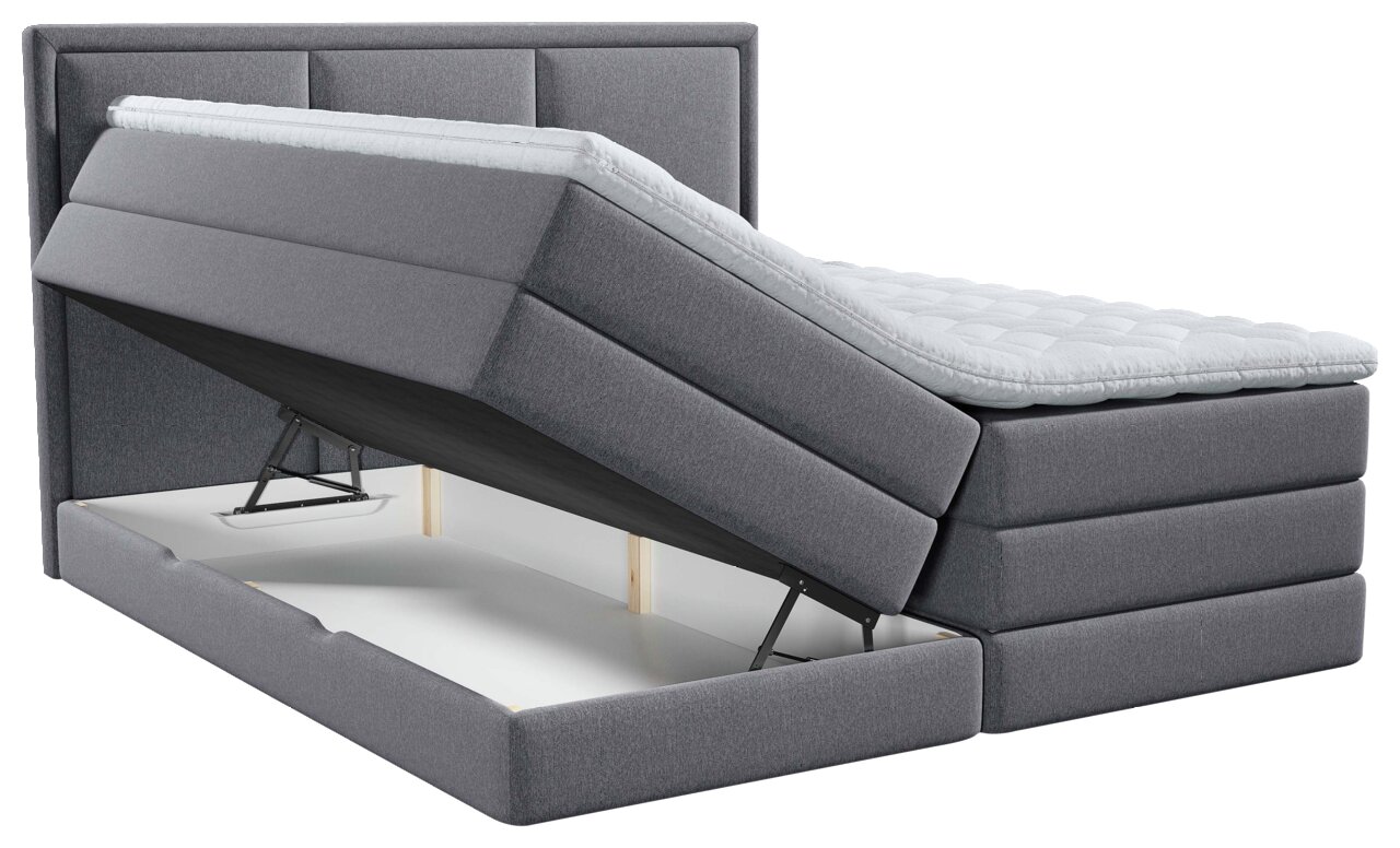 Grijs boxspringbed met opklapbaar matras en zichtbare opbergruimte, zijaanzicht