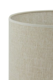 Close-up van een beige lampenkap met een gestructureerd oppervlak, gezien vanaf de zijkant