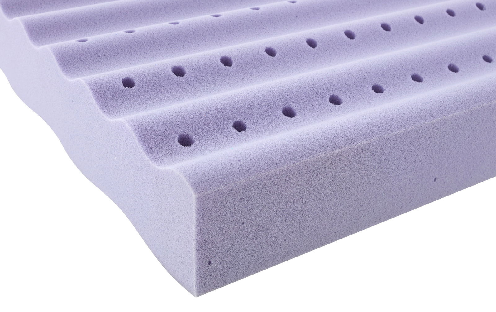 Nahaufnahme einer lila Jugendmatratze mit wellenförmiger Oberfläche und Belüftungslöchern, seitliche Perspektive