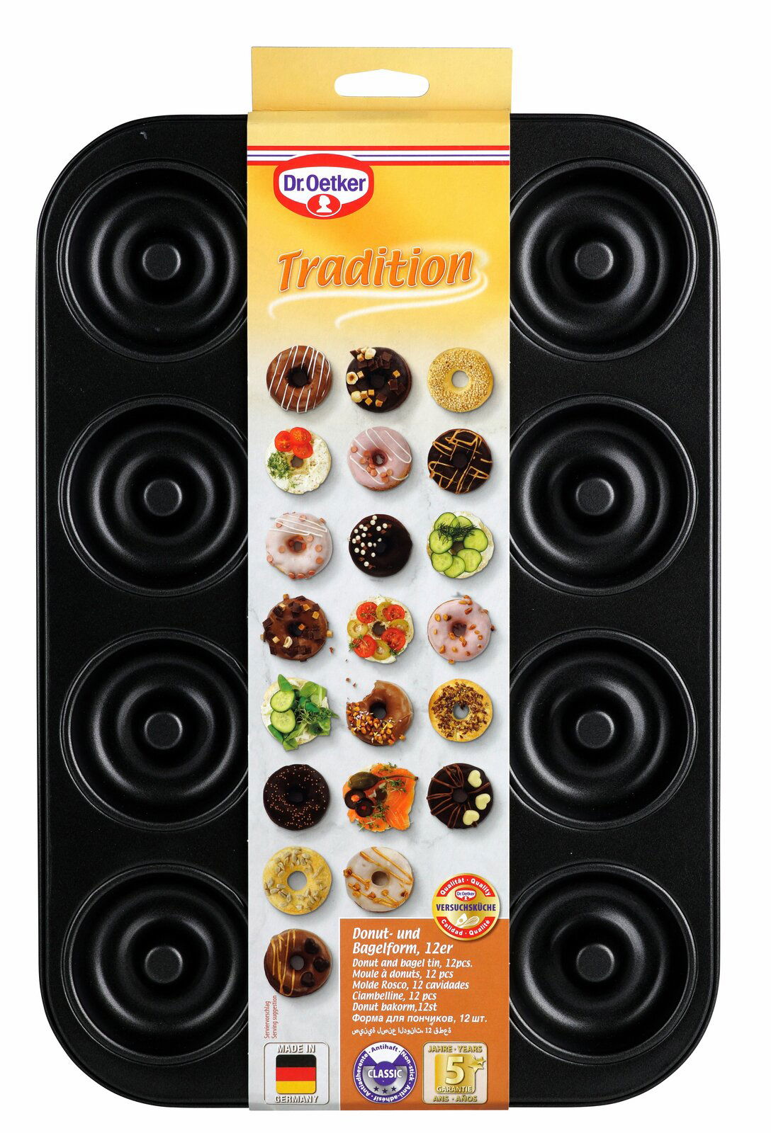 Donutbackform mit 12 Mulden, Vorderansicht, inklusive Verpackung mit Abbildungen von dekorierten Donuts.