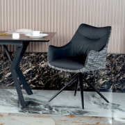 Moderne fauteuil met zwarte zitting en rugleuning van stof met patroon, zijaanzicht