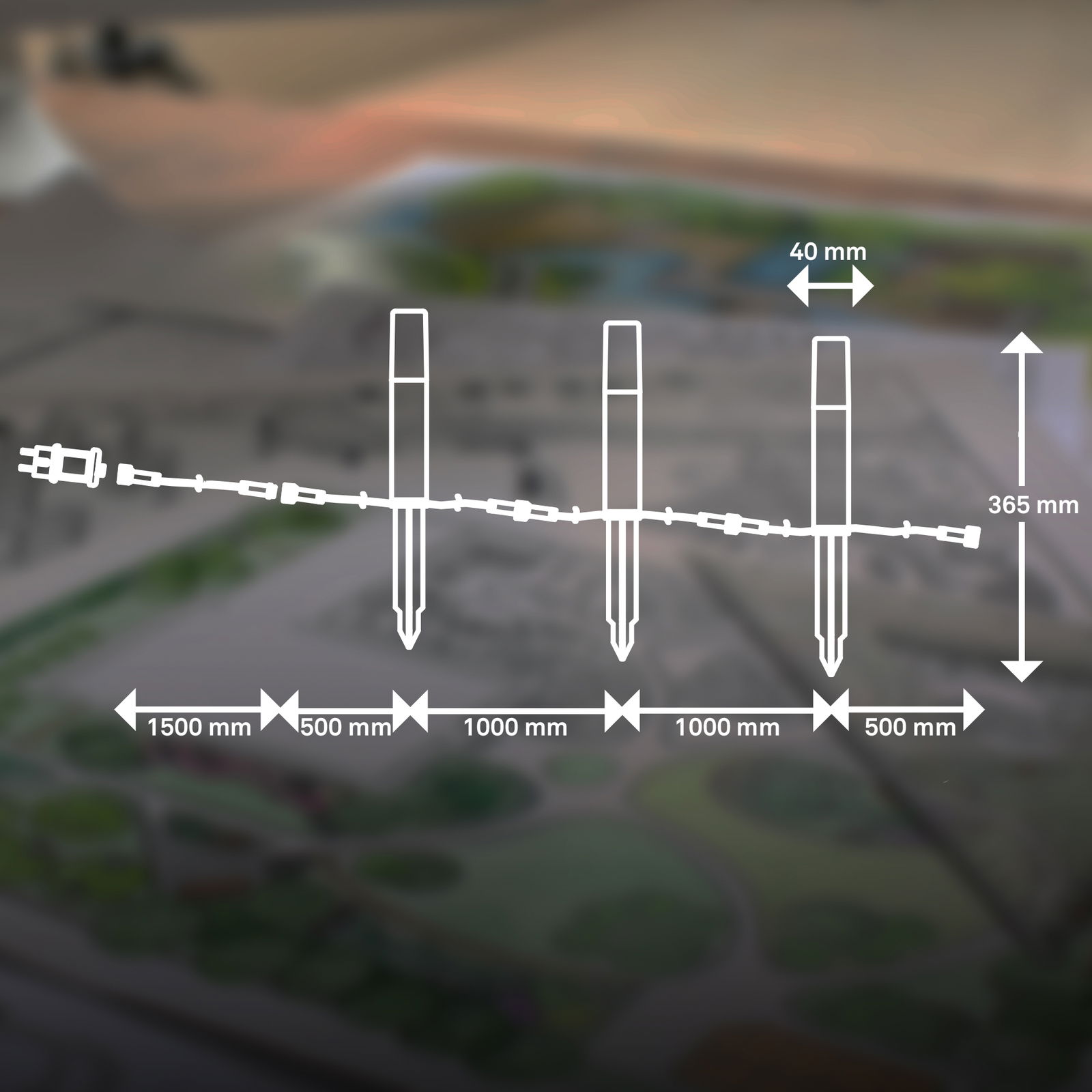 Diagramm eines Erdspieß-Startersets mit vier Erdspießen, verbunden durch Kabel, mit Abmessungen in Millimetern. Perspektive: seitliche Ansicht.