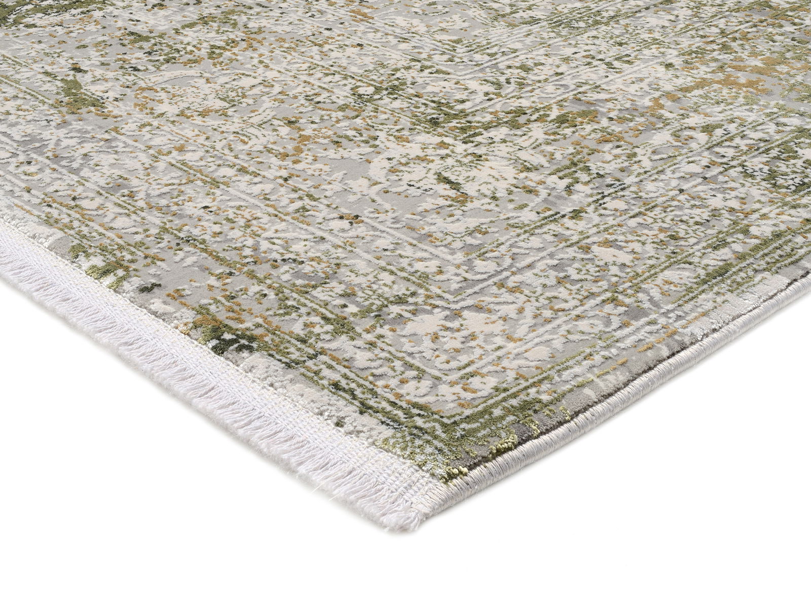 Designer Teppich mit abstraktem Muster in Grün- und Grautönen, Nahaufnahme der Ecke mit Fransen.