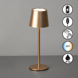 Goldene Akku-Tischleuchte ROXI mit zylindrischem Schirm, USB-Anschluss, Touch-Bedienung, CCT-Farbtemperaturregelung und IP44-Schutz, seitliche Perspektive.