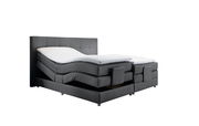 Graues Boxspringbett mit verstellbaren Matratzen, seitliche Perspektive