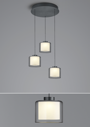 Dreifache LED-Pendelleuchte KLARA mit zylindrischen, weißen Schirmen, von unten betrachtet.