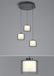 Dreifache LED-Pendelleuchte KLARA mit zylindrischen, weißen Schirmen, von unten betrachtet.