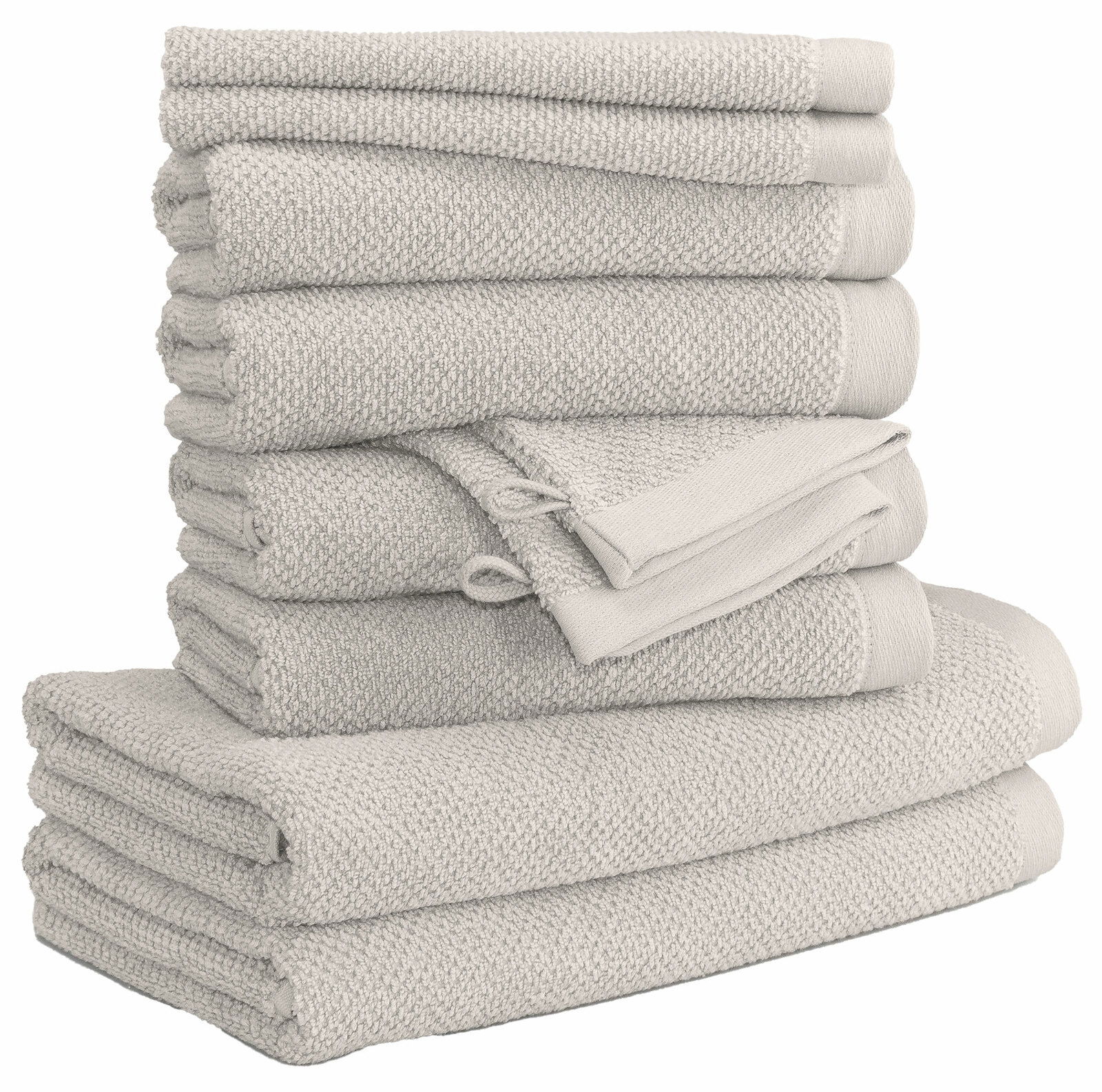 Stapel von beigefarbenen Handtüchern in verschiedenen Größen, seitliche Perspektive