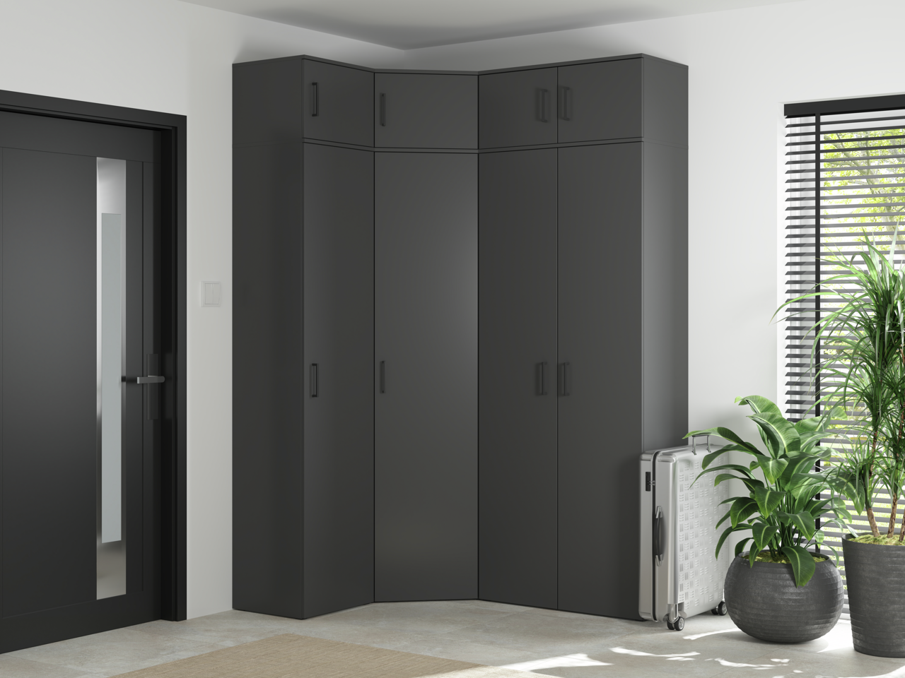 Carryhome Eckschrank MULTISTAURAUM Eckschrank in modernem Design, dunkelgrau, in einer Ecke eines hellen Raumes mit Pflanzen und einem Koffer, seitliche Perspektive