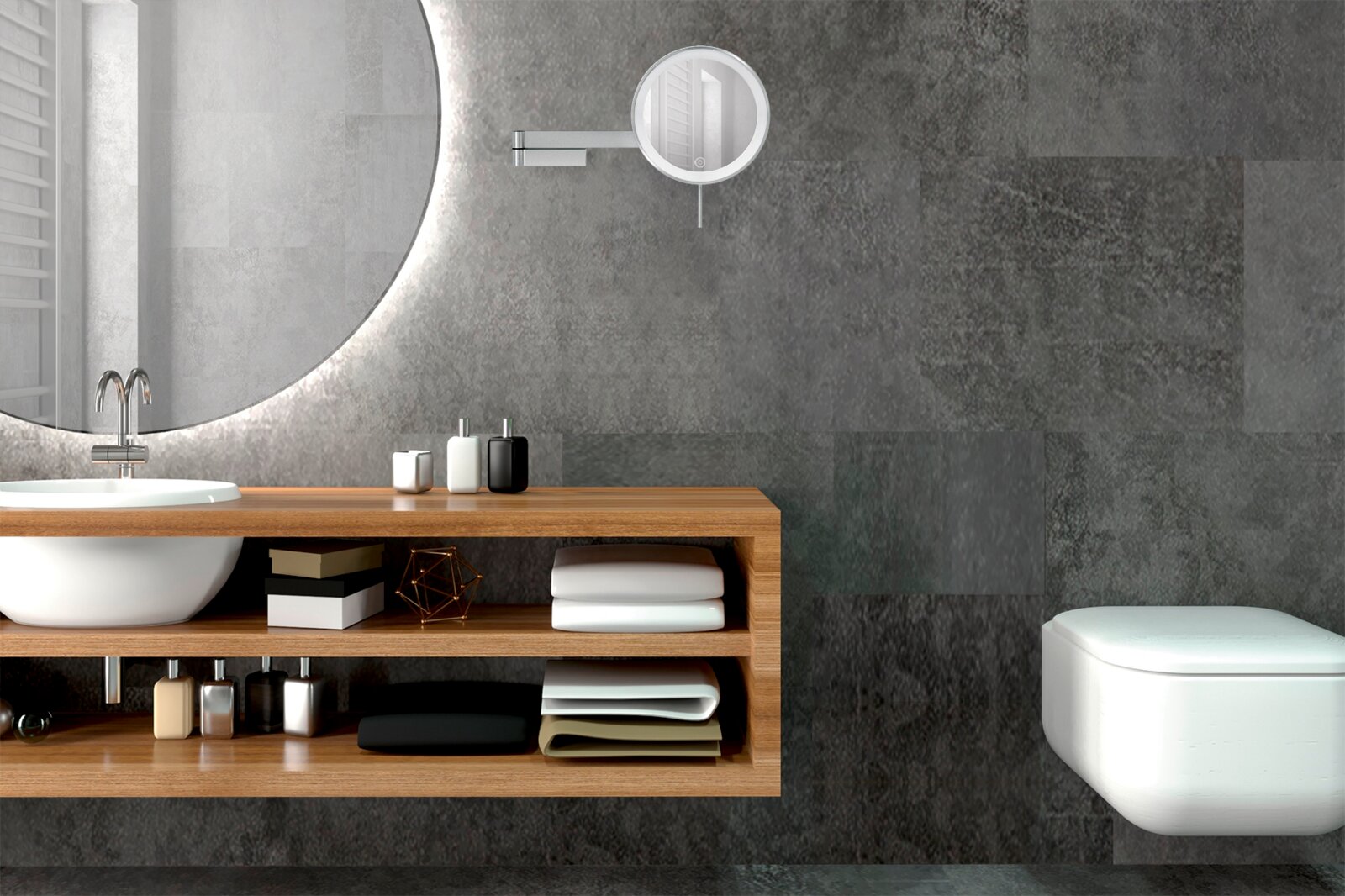 Modernes Badezimmer mit rundem, hinterleuchtetem Spiegel, Waschtisch mit Holzregal und wandhängendem WC vor grauen Fliesen, Frontansicht mit leicht seitlicher Perspektive.