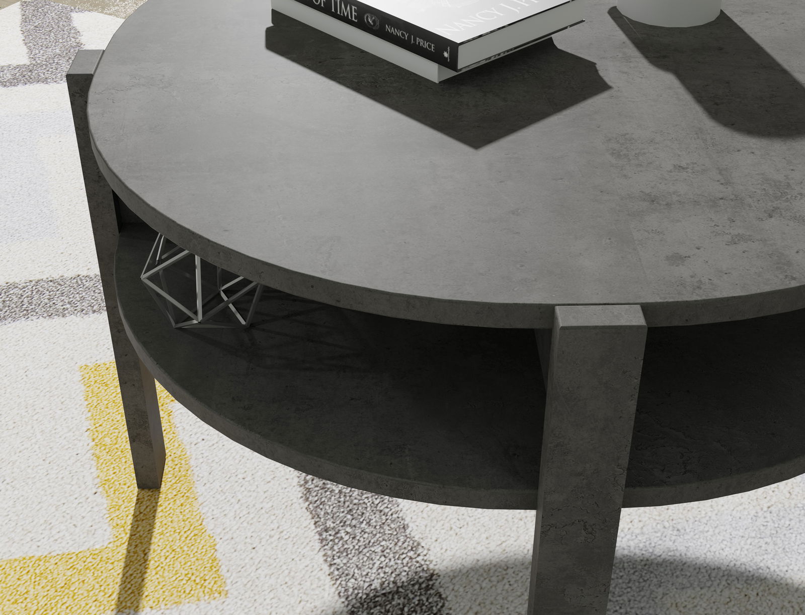 Runder Couchtisch aus dunklem Material mit zwei Ebenen, von oben betrachtet. Auf der oberen Ebene liegen Bücher, die untere Ebene ist leer.