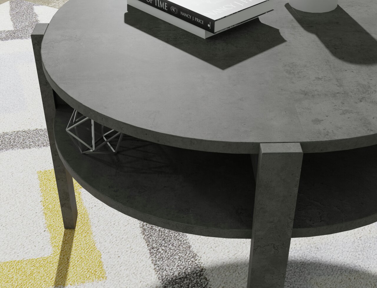 Ronde salontafel van donker materiaal met twee niveaus, gezien van bovenaf. Op het bovenste niveau liggen boeken, het onderste niveau is leeg.