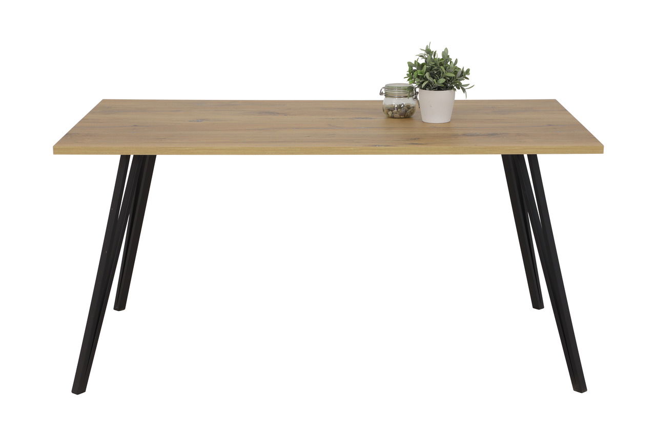 Moderner Esstisch mit Holzplatte und schwarzen Metallbeinen, frontal fotografiert. Dekoriert mit einer kleinen Pflanze und einem Glasgefäß.