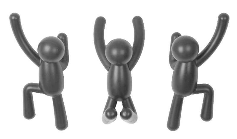 Drei schwarze Buddy Wandhaken in Form von kletternden Figuren, frontal betrachtet.