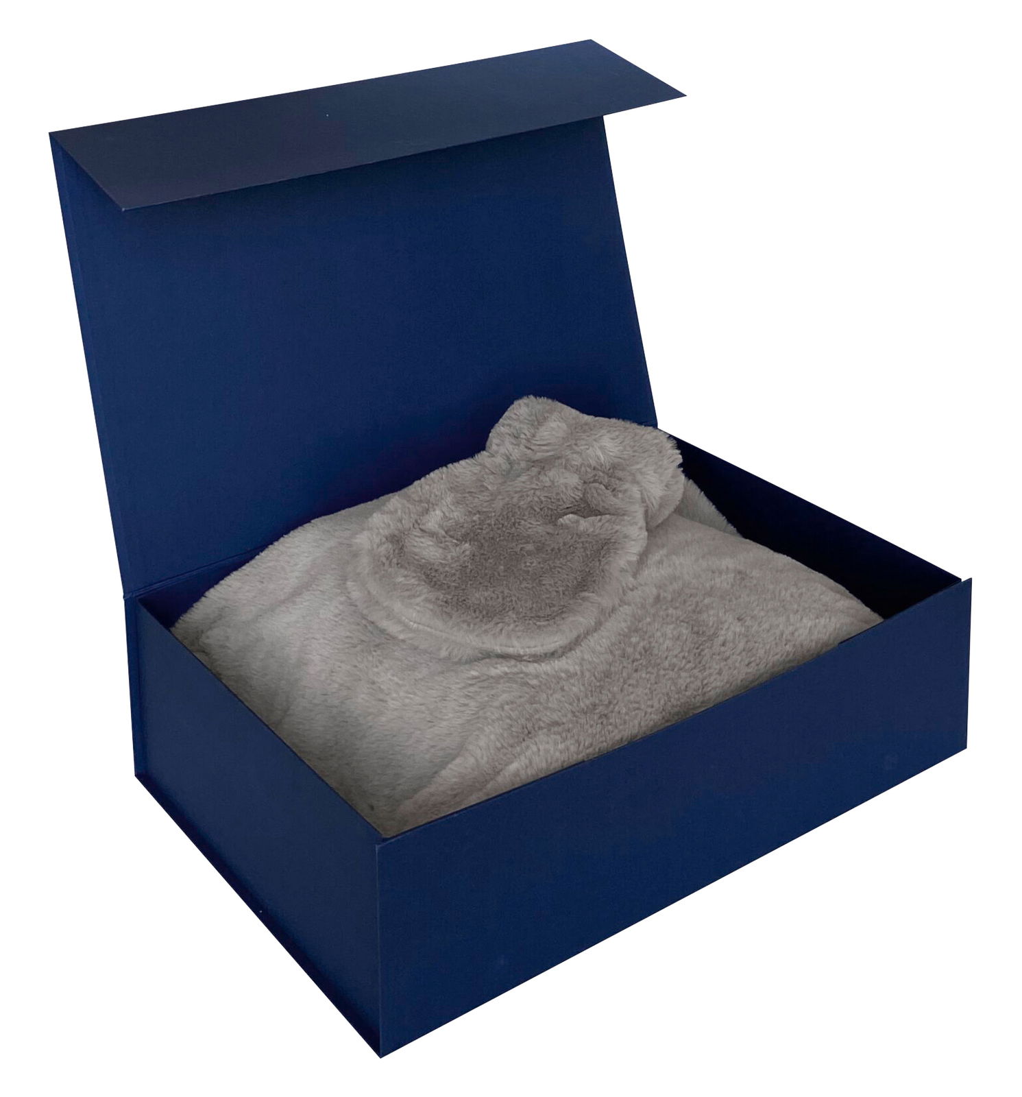 Geschenkset in einer offenen blauen Box mit weicher, grauer Decke, Ansicht von oben.