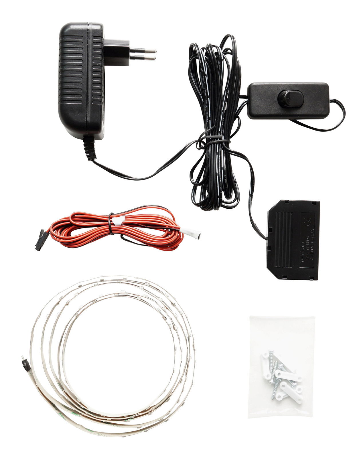 Linea Natura LED-Bandbeleuchtung PHÖNIX LED-Bandbeleuchtung Set mit Netzteil, Steuerungseinheit, Kabeln und Befestigungsmaterial, aus der Vogelperspektive fotografiert.