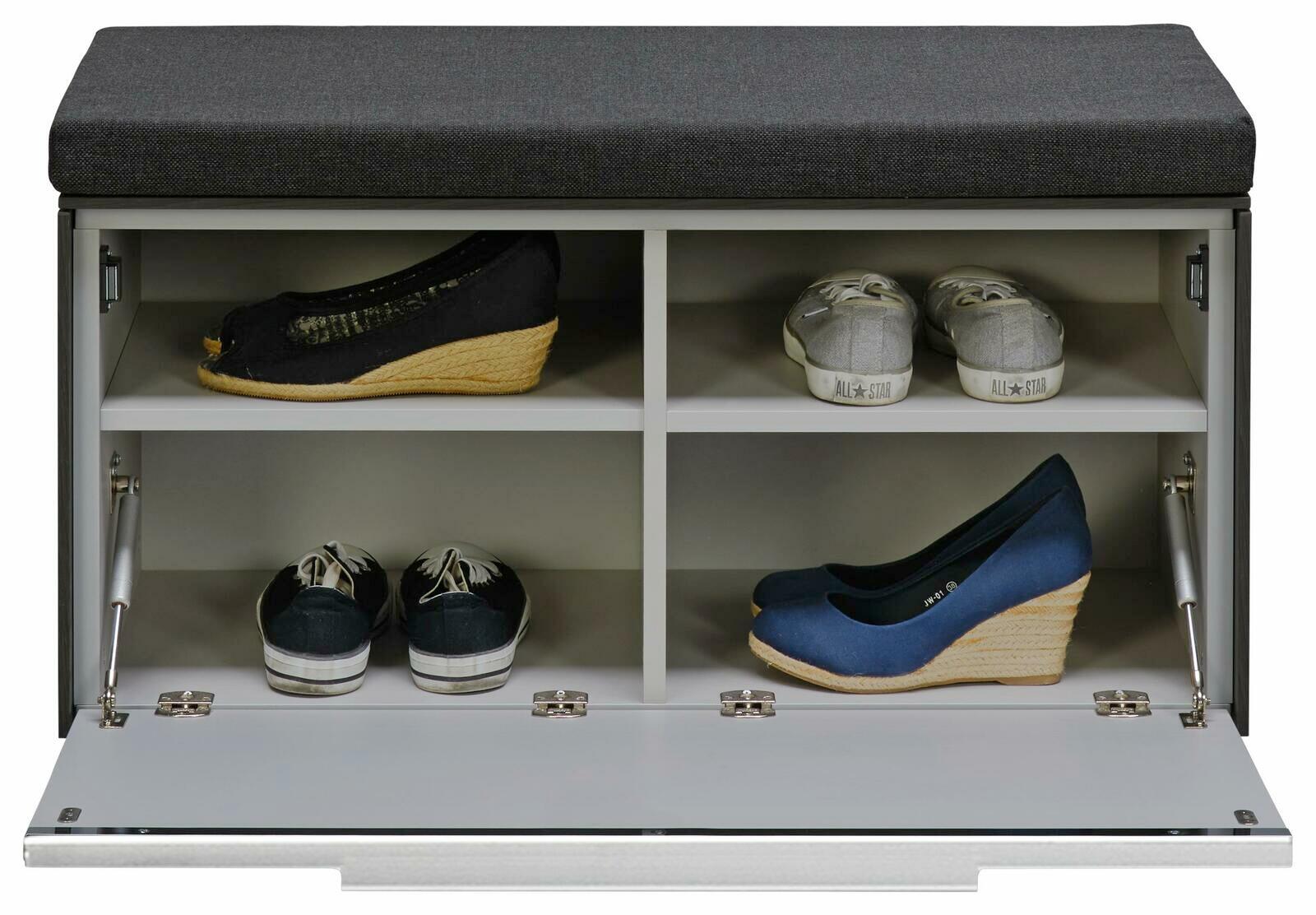 Voleo Bank LUXOR Schuhbank mit gepolsterter Sitzfläche in der Farbe Dunkelgrau, mit geöffneter Klappe und vier Fächern zur Schuhaufbewahrung, frontal betrachtet.
