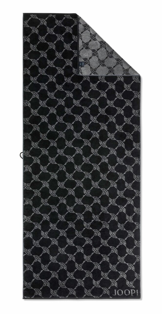 Zwarte saunadoek met grijs geometrisch patroon en JOOP!-logo, gefotografeerd vanuit vogelperspectief.