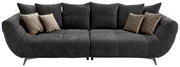 Großes, modernes Sofa in dunklem Grau mit mehreren Kissen, frontal betrachtet.