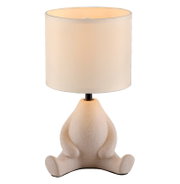 Verspielte Tischlampe mit weißem zylindrischem Stoffschirm und beigem, gesprenkeltem Frosch-Fuß aus Keramik, frontal in leichter Aufsicht vor grauem Hintergrund