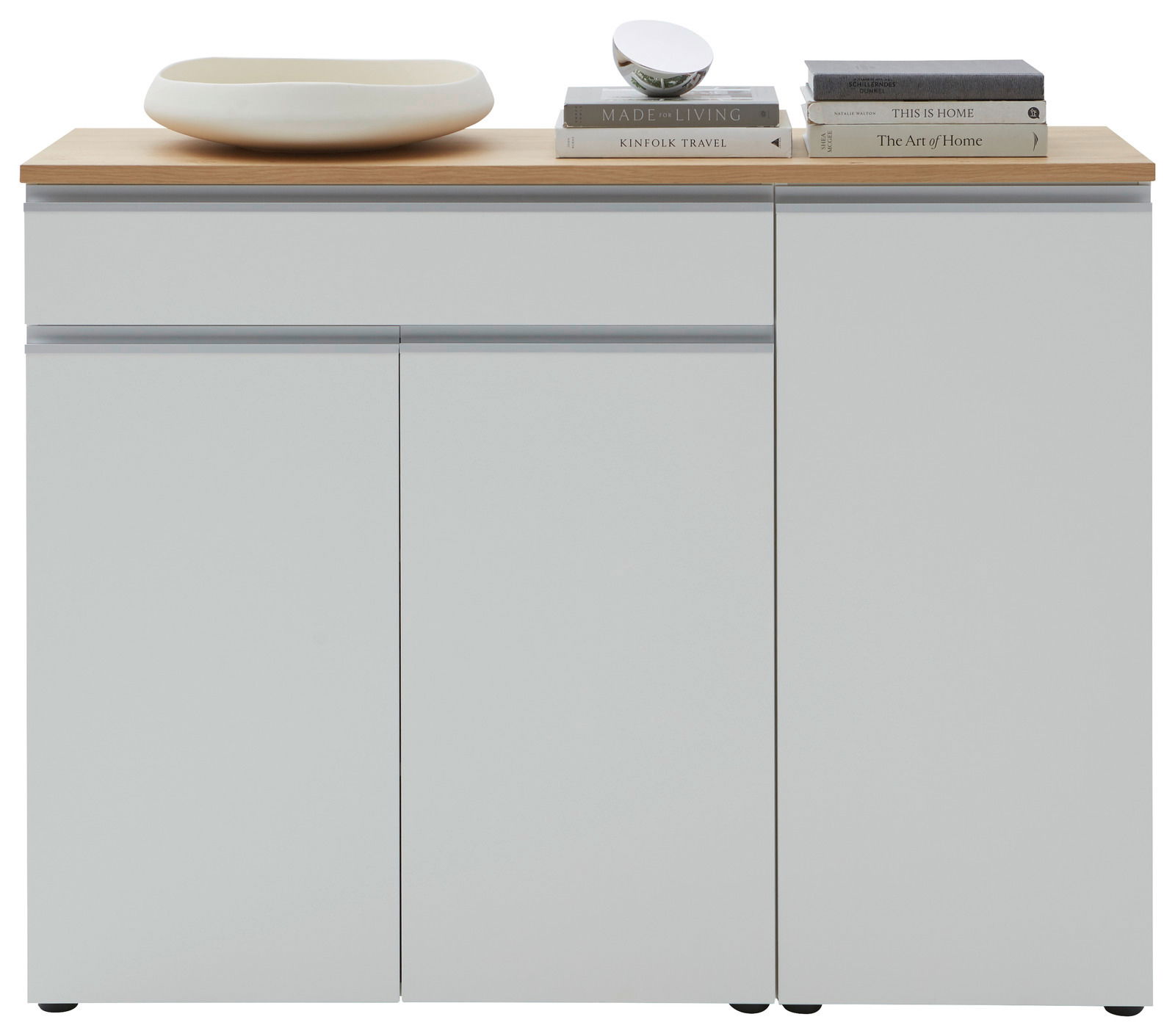 Frontansicht einer modernen Kombi-Kommode mit weißer Oberfläche und Holzplatte, dekoriert mit Büchern und einer Schale.