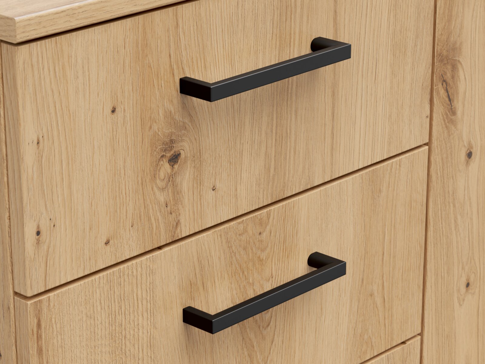 Nahaufnahme einer Kommode aus hellem Holz mit schwarzen Griffen, seitliche Perspektive