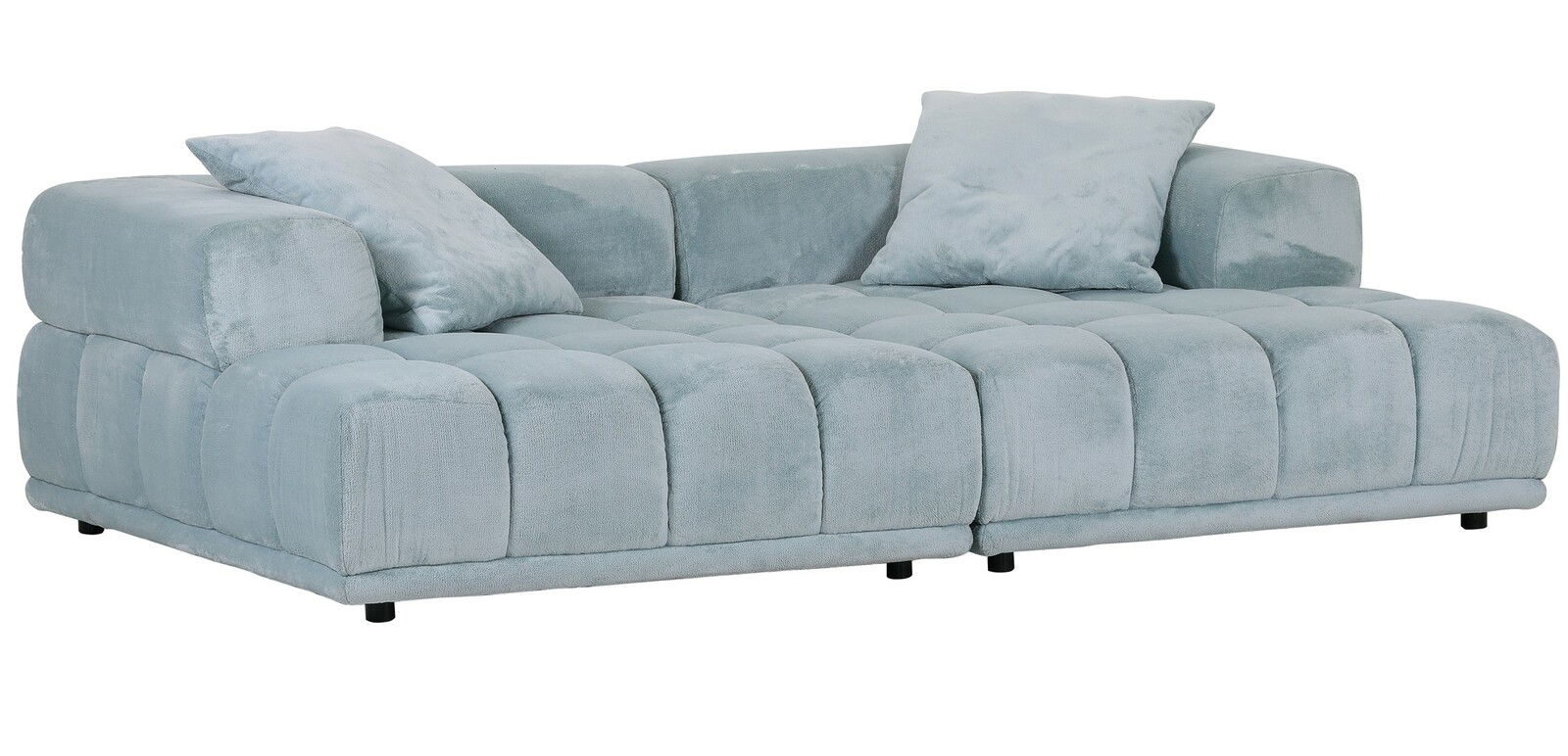 Großes, modernes Big-Sofa in hellblauem Stoff mit zwei passenden Kissen, seitliche Perspektive.