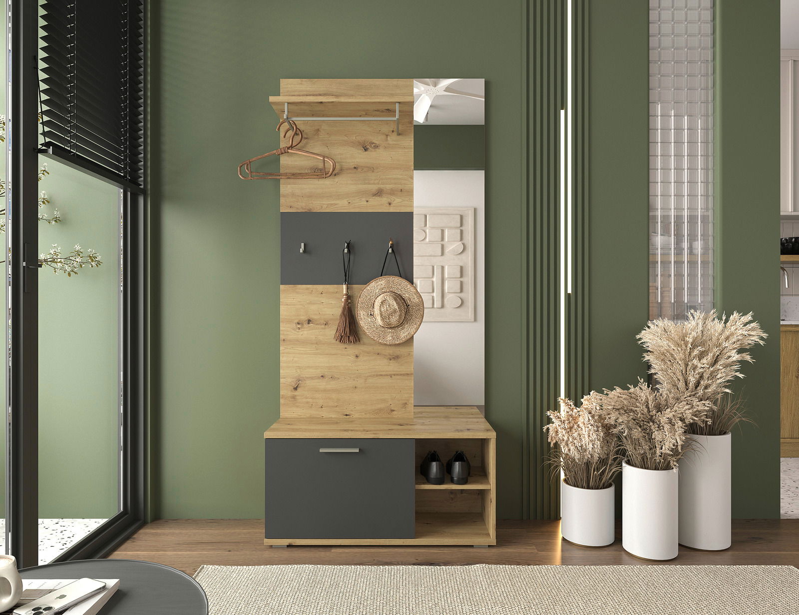 Kompaktgarderobe aus Holz mit Kleiderstange, Haken und Stauraum, frontal fotografiert in einem modern eingerichteten Raum mit grüner Wand.