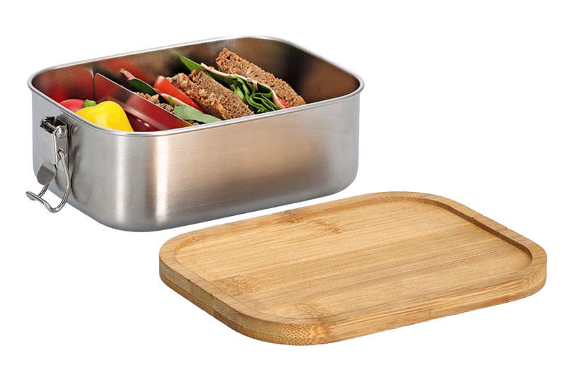 Lunchbox aus Edelstahl mit Clipverschluss, gefüllt mit Sandwiches und Gemüse, abnehmbarer Bambusdeckel, seitliche Perspektive
