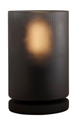Zylindrische Tischleuchte COLOMERA mit geriffeltem, dunklem Glas und warmem Licht, seitliche Perspektive