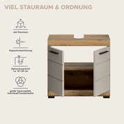 Badezimmer-Waschtischunterschrank in Holzoptik mit zwei geöffneten weißen Türen und schwarzen Griffen, mit Siphonausschnitt in der Deckplatte; Frontansicht.