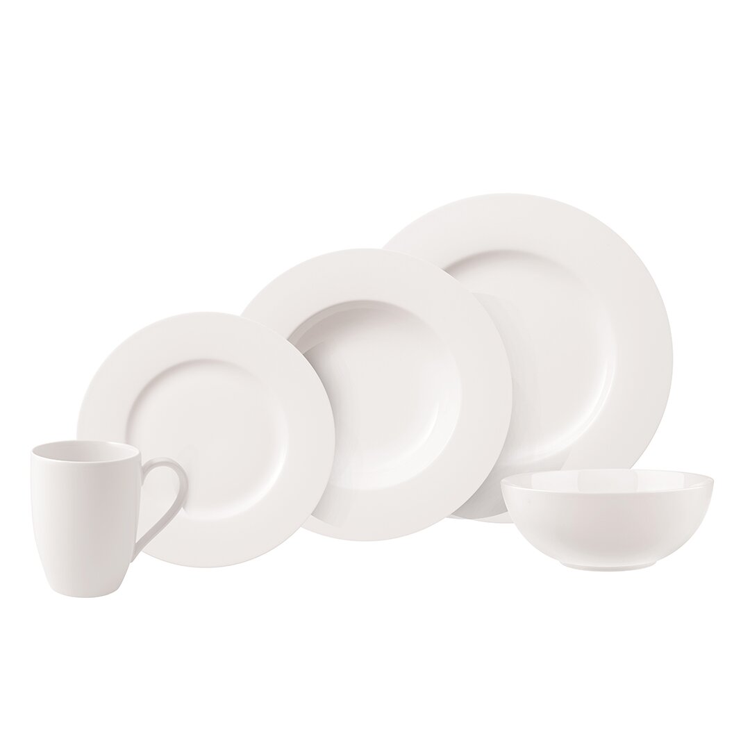 Kombiservice Basic White 20-teilig, bestehend aus Tasse, Schüssel und verschiedenen Tellern, aus seitlicher Perspektive fotografiert.