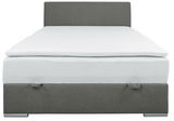 Frontale Ansicht eines grauen Boxbetts mit weißer Matratze und Kopfteil.