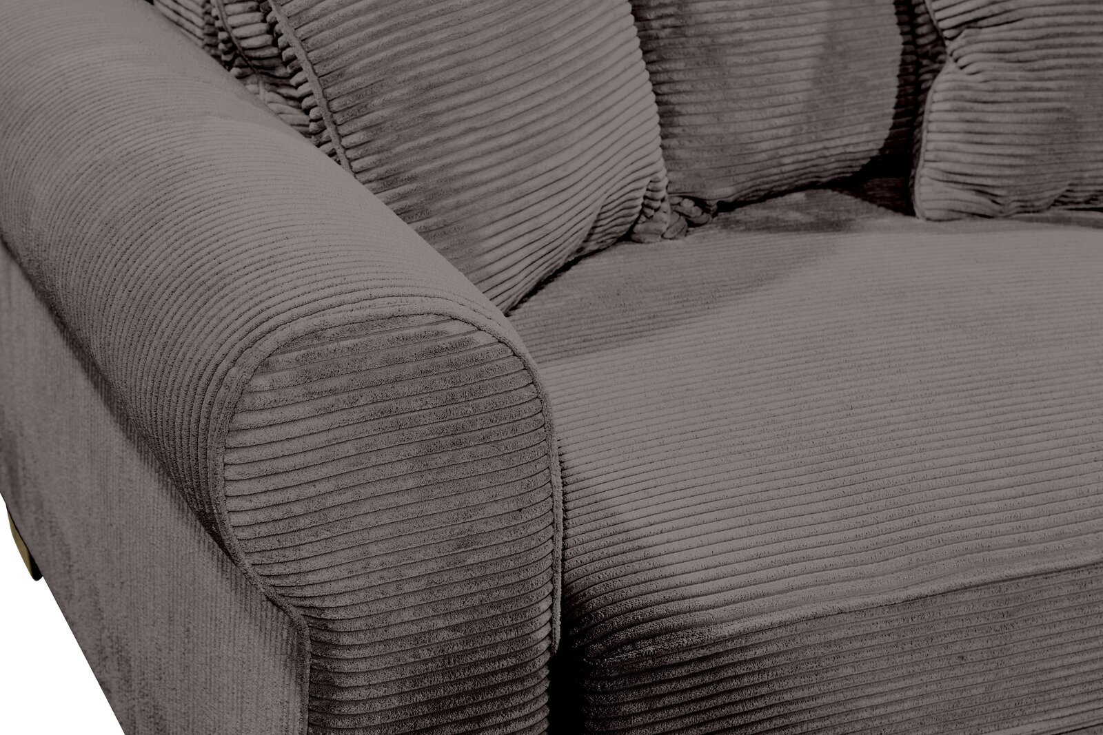 Nahaufnahme einer grauen, gerippten Sofaecke mit Armlehne, von schräg oben fotografiert.