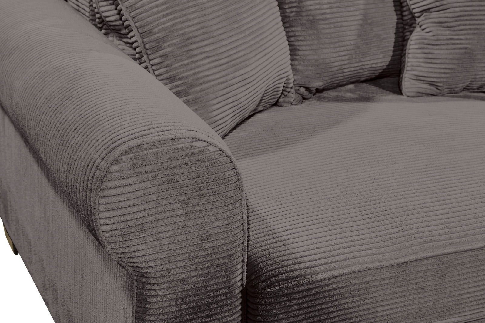 Nahaufnahme einer grauen, gerippten Sofaecke mit Armlehne, von schräg oben fotografiert.