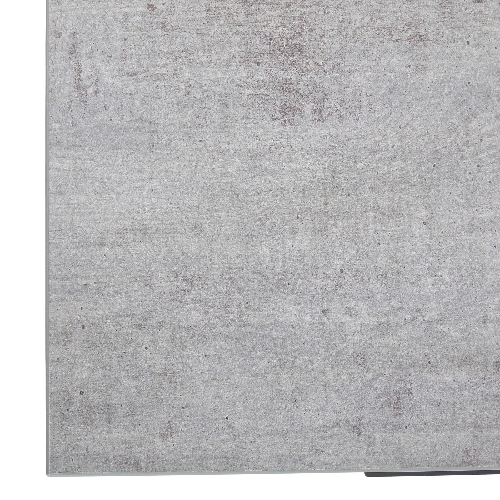 Nahaufnahme der Oberfläche eines Eckschreibtisches in Betonoptik, perspektivisch von oben betrachtet.