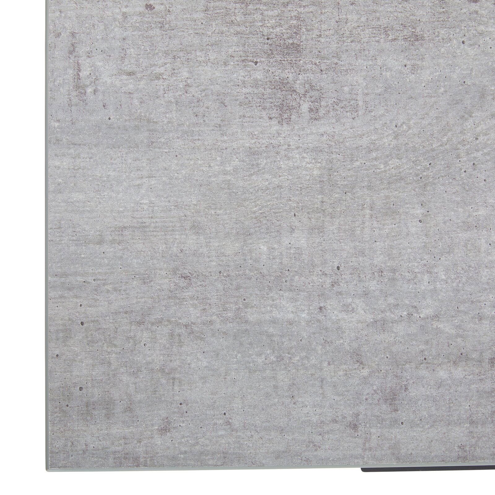 Nahaufnahme der Oberfläche eines Eckschreibtisches in Betonoptik, perspektivisch von oben betrachtet.