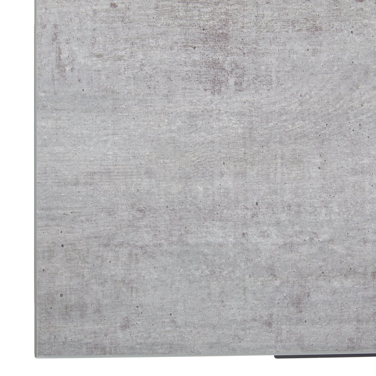 Nahaufnahme der Oberfläche eines Eckschreibtisches in Betonoptik, perspektivisch von oben betrachtet.
