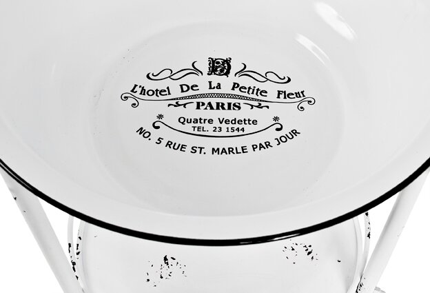 Runde weiße Emaille-Schüssel mit schwarzem Rand und französischem „L’hotel De La Petite Fleur PARIS“-Aufdruck, von oben fotografiert