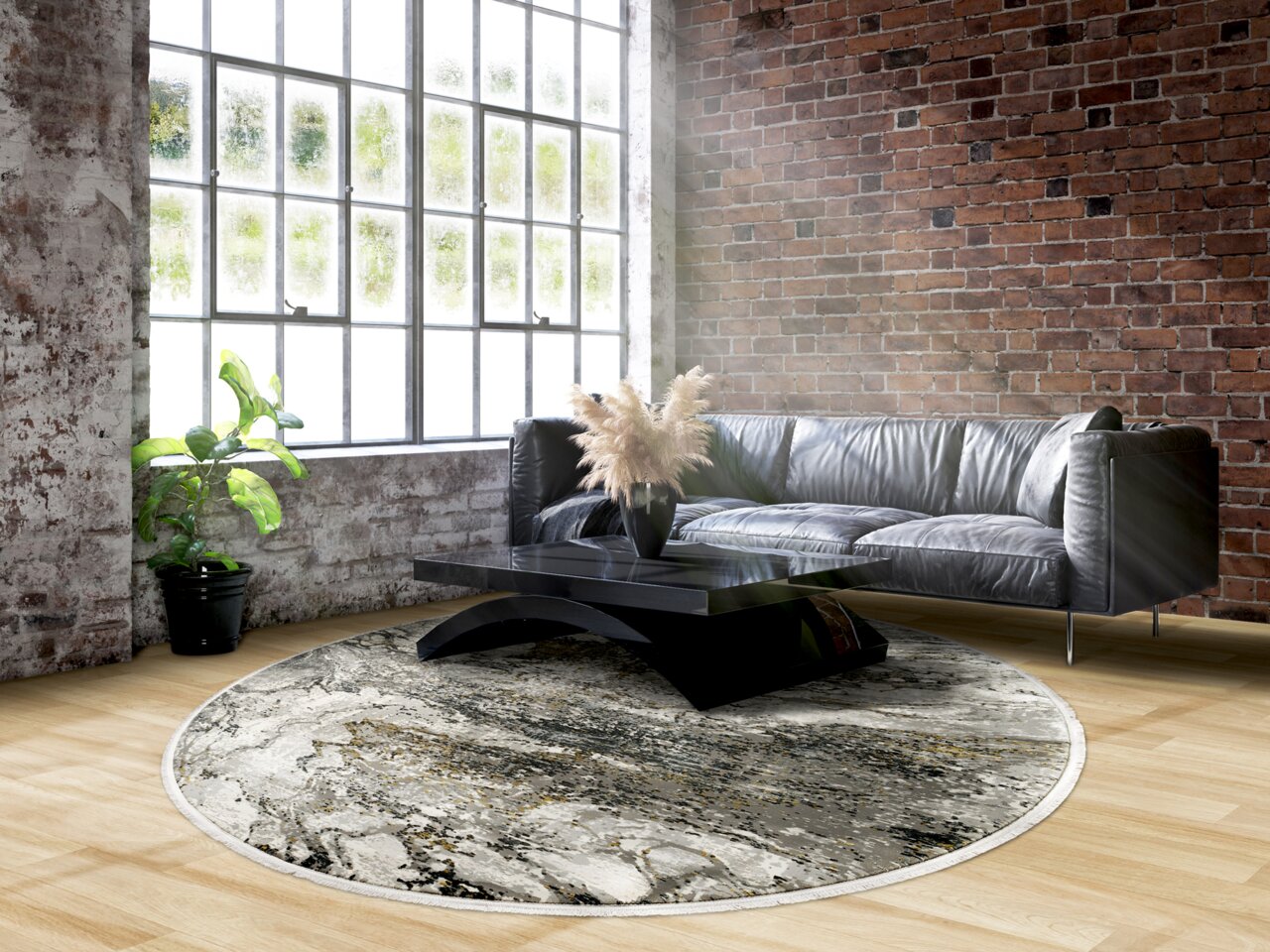 Runder Designer Teppich in einem modernen Wohnzimmer mit Ledersofa und Couchtisch, aus der Perspektive von oben betrachtet.
