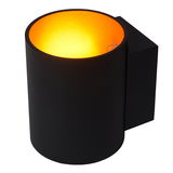 Schwarze zylindrische Wandleuchte XERA von Lucide mit warmem gelbem Licht, seitliche Perspektive
