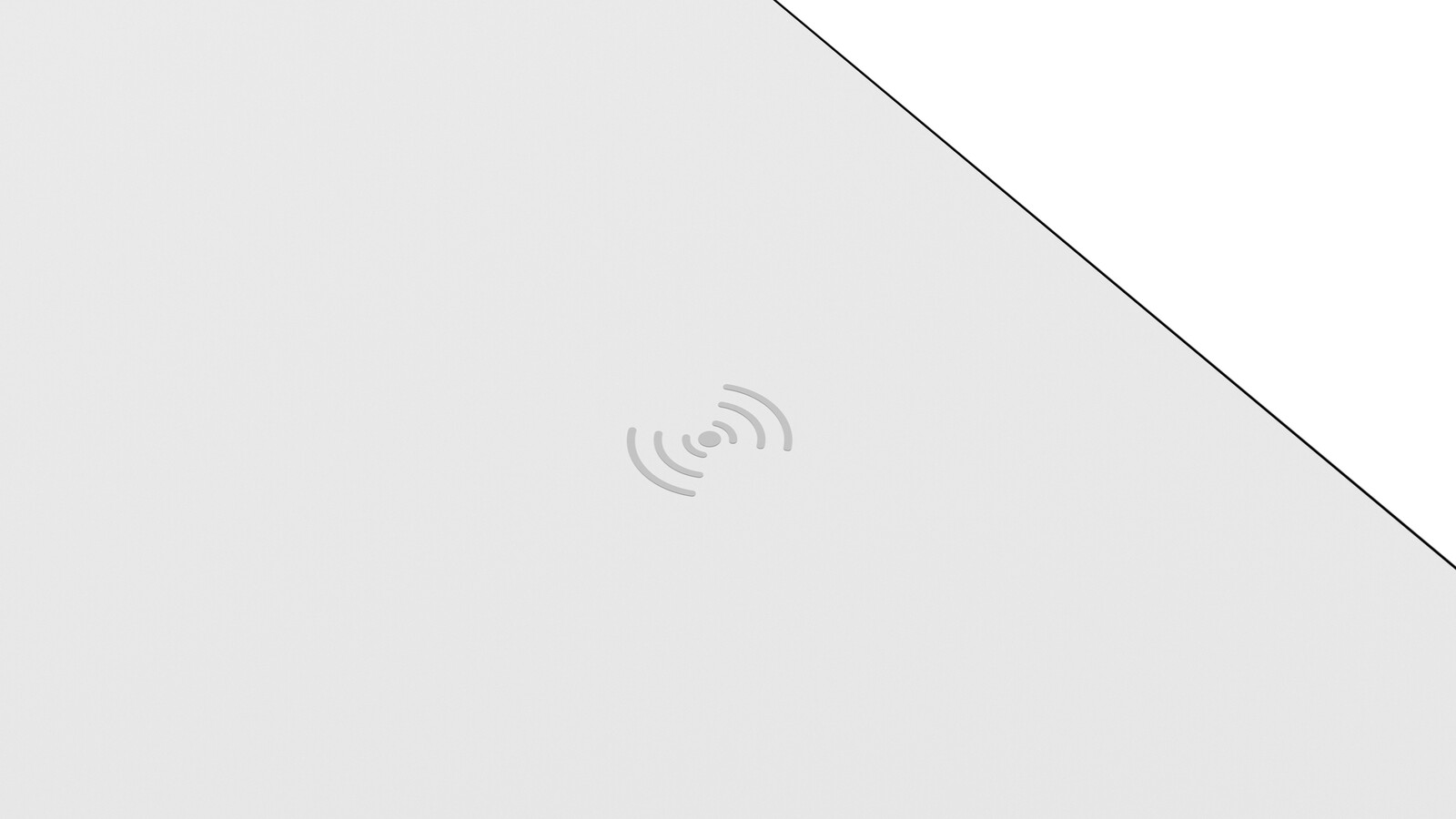 Draufsicht auf eine weiße Tischplatte mit integriertem kabellosen Ladegerät.