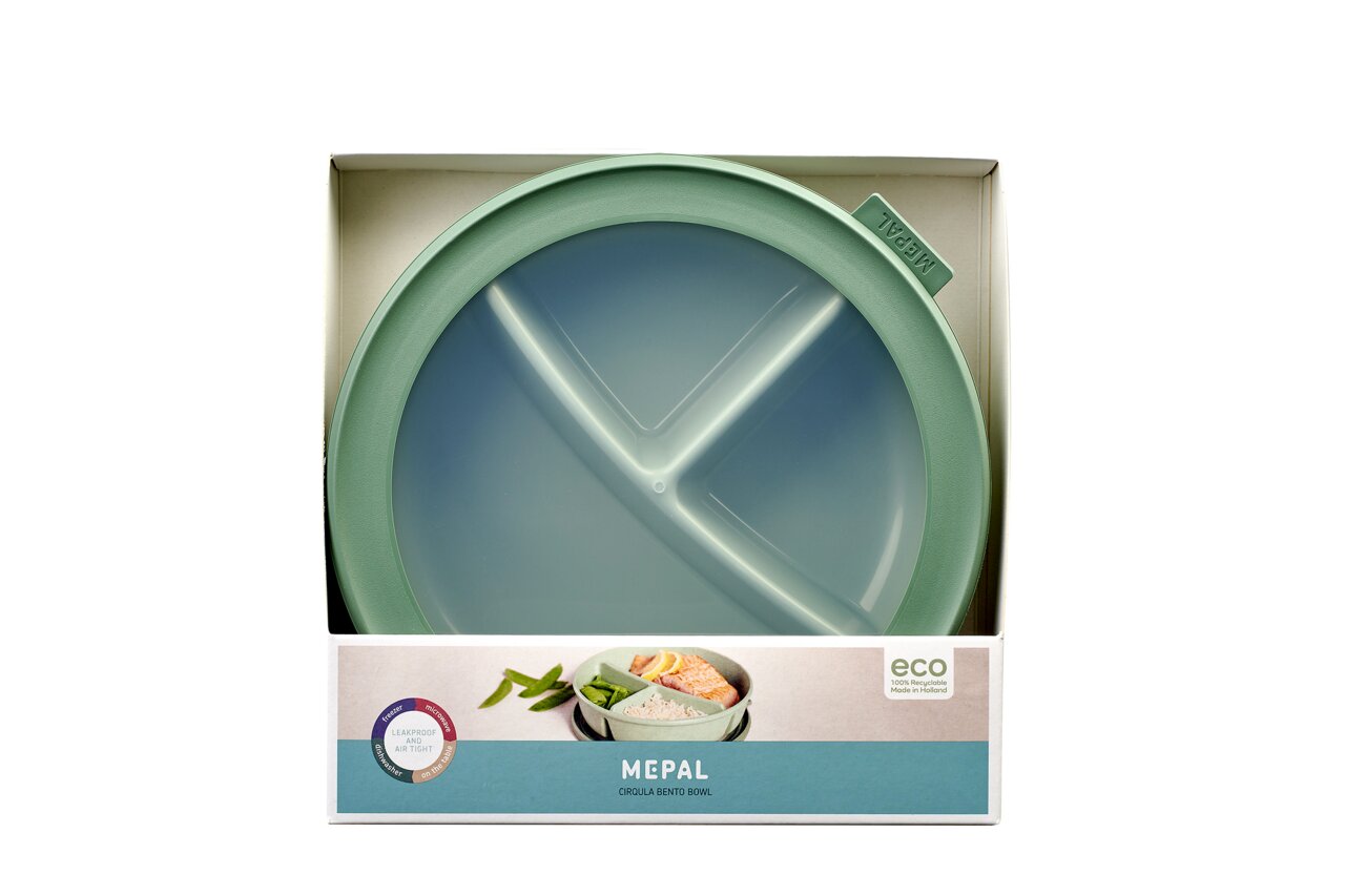 Grüne runde Bento-Schale Cirqula von Mepal in einer Verpackung, von oben fotografiert