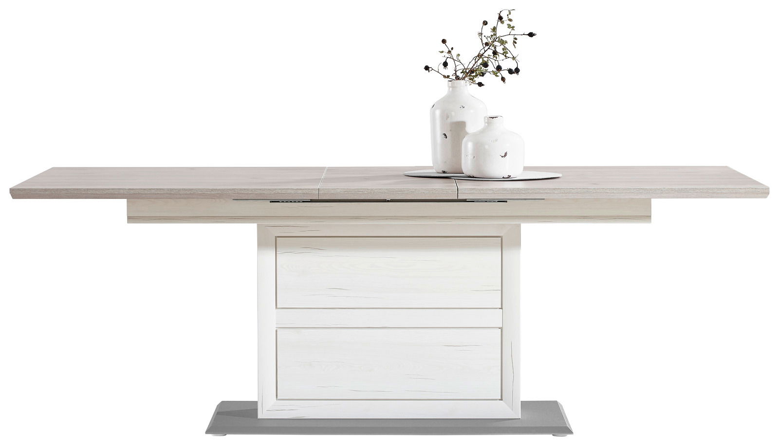 Moderner Funktions-Esstisch CAMRON in heller Holzoptik, frontal fotografiert, mit zwei weißen Vasen und einem dekorativen Zweig darauf.