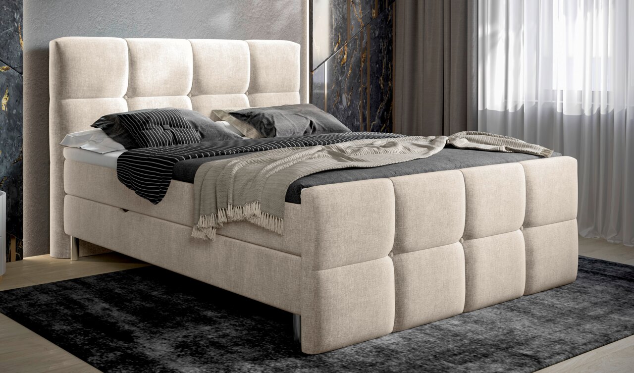 Beige boxspring met gestoffeerd hoofd- en voeteneinde, zijaanzicht