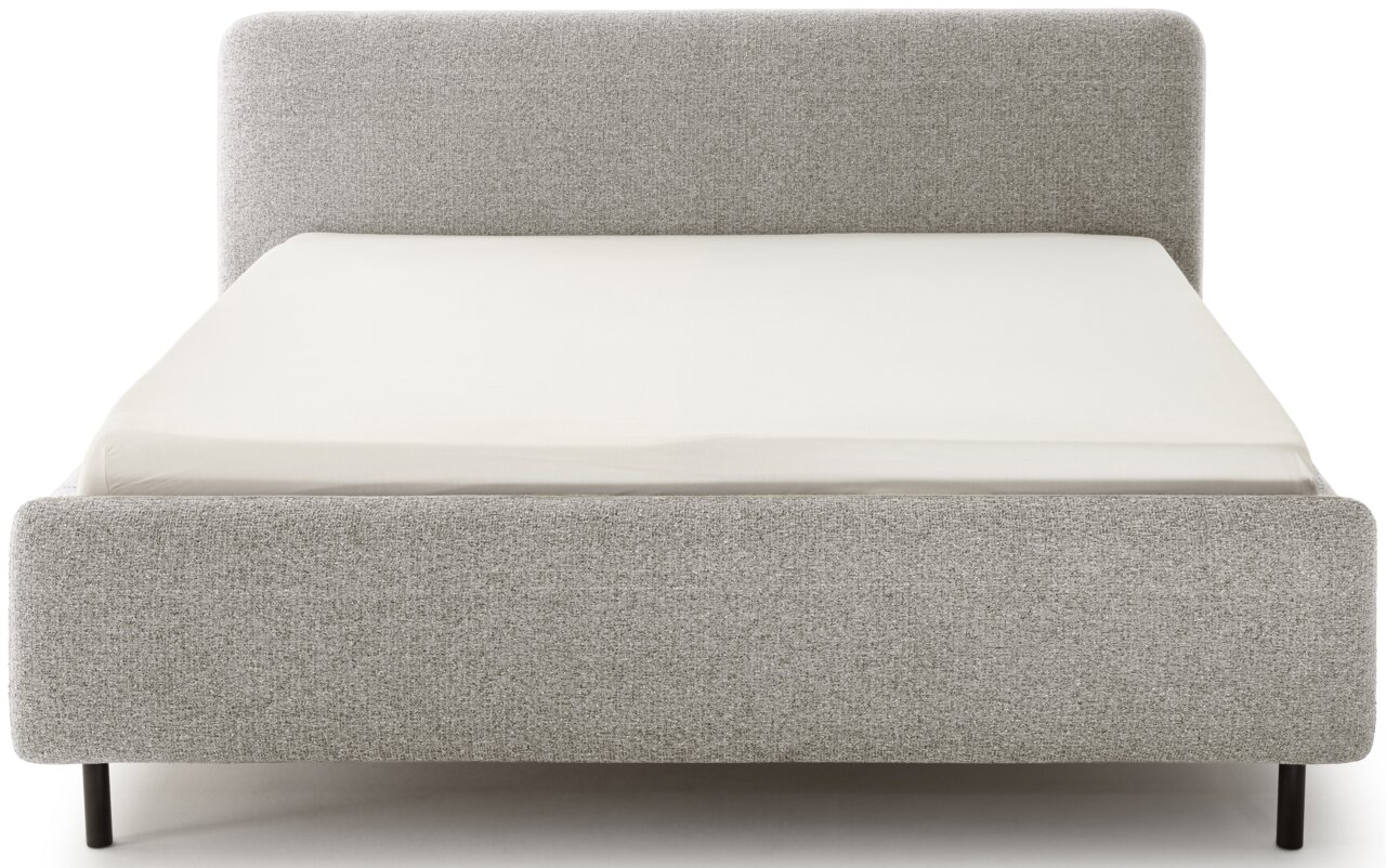Grijs boxspringbed in vooraanzicht, met een strak ontwerp en een zwart frame.