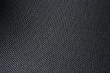 Nahaufnahme eines schwarzen Stoffbezugs mit feiner Textur, Draufsicht