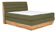 Boxspringbett mit olivgrünem Stoffbezug und Holzrahmen, seitliche Perspektive